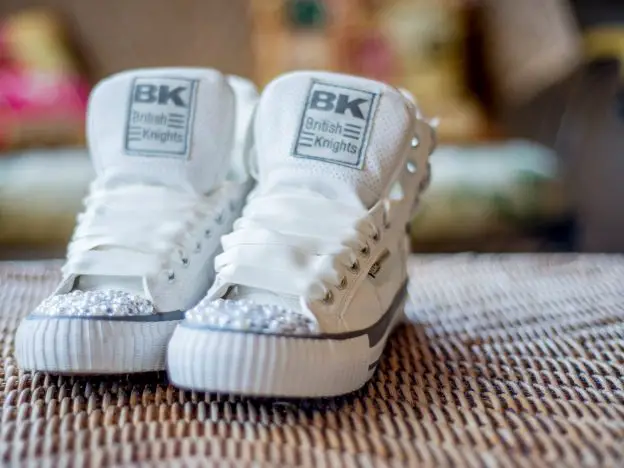 BK trainers with white satin laces and pearls and diamontes on the toes