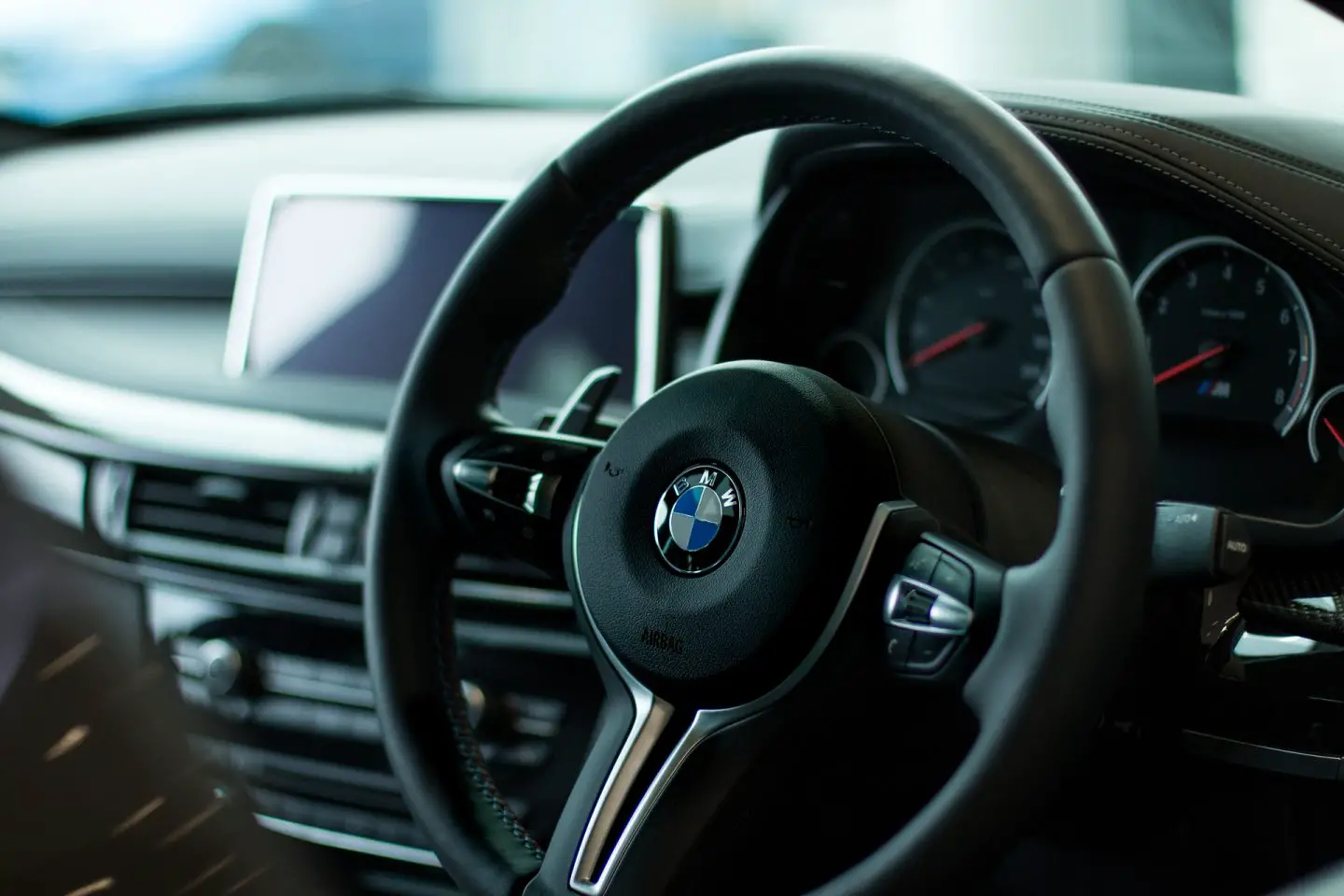 The steering wheel of a BMW car