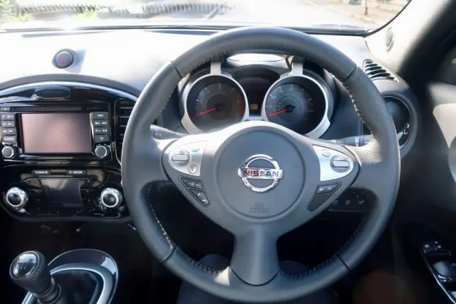 The steering wheel and dashboard of a Nissan Juke