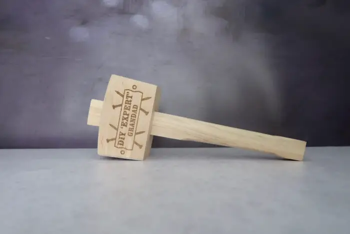 A wooden mallet with "Grandad DIY Expert" written on it.