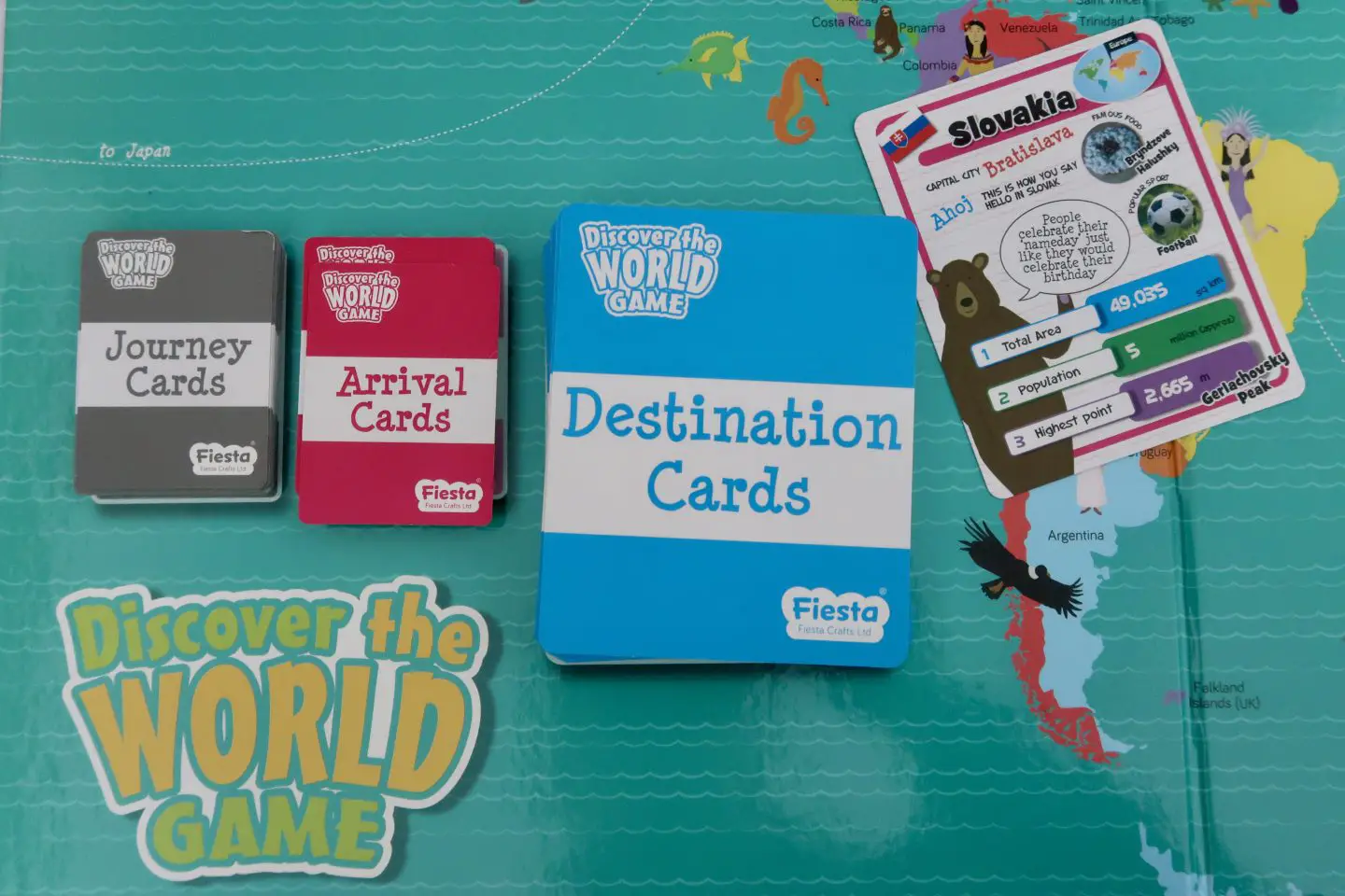 A corner of the Discover The World Game board, with Destination cards, Journey cards and Arrival cards