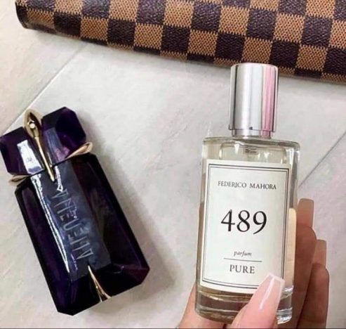 A bottle of Theirry Mugler, Alien perfume and a bottle of FM 489