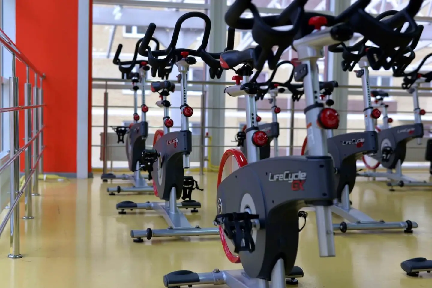 A room full of spin bikes in a gym