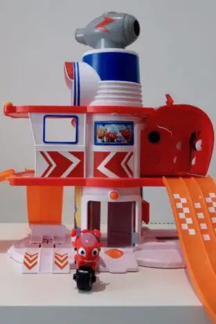 A Ricky Zoom playset with a Ricky Zoom character in front