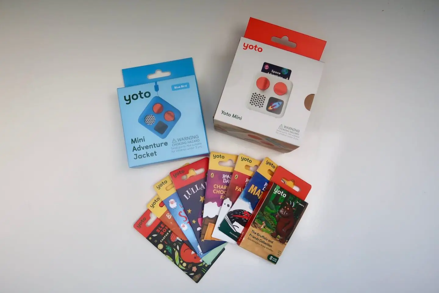 The packaging for a Yoto mini player, adventure jacket and an array for Yoto cards