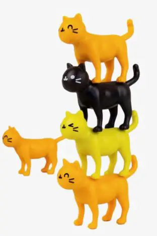 Plastic cartoon cats stacked on top of each other