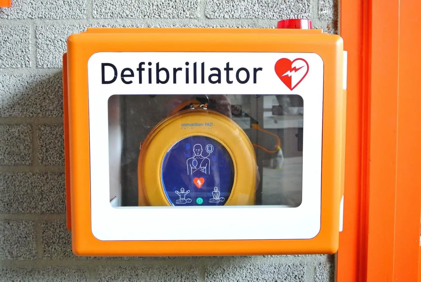 a defibrillator in an orange box